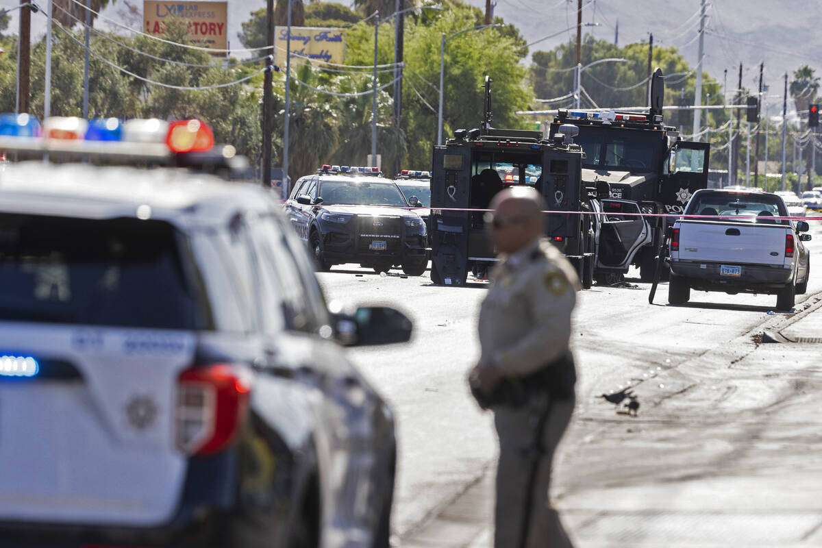 Police investigate after a suspected kidnapper was shot by an officer near East Charleston and ...