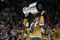 Vegas Golden Knights defenseman Zach Whitecloud (2) skates with the Stanley Cup after the Knigh ...