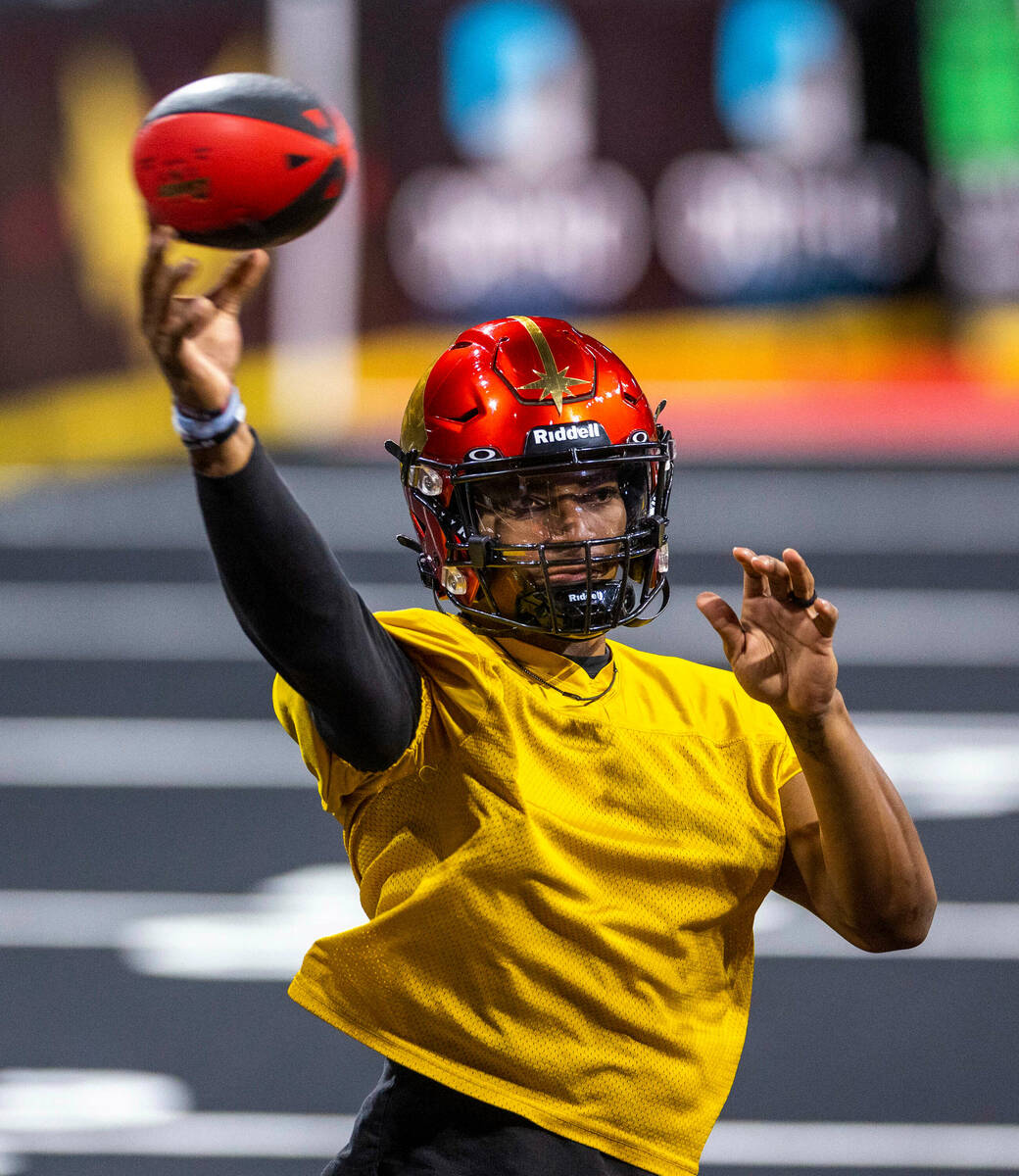 Vegas Knight Hawks quarterback Daquan Neal releases a pass during practice at The Dollar Loan C ...