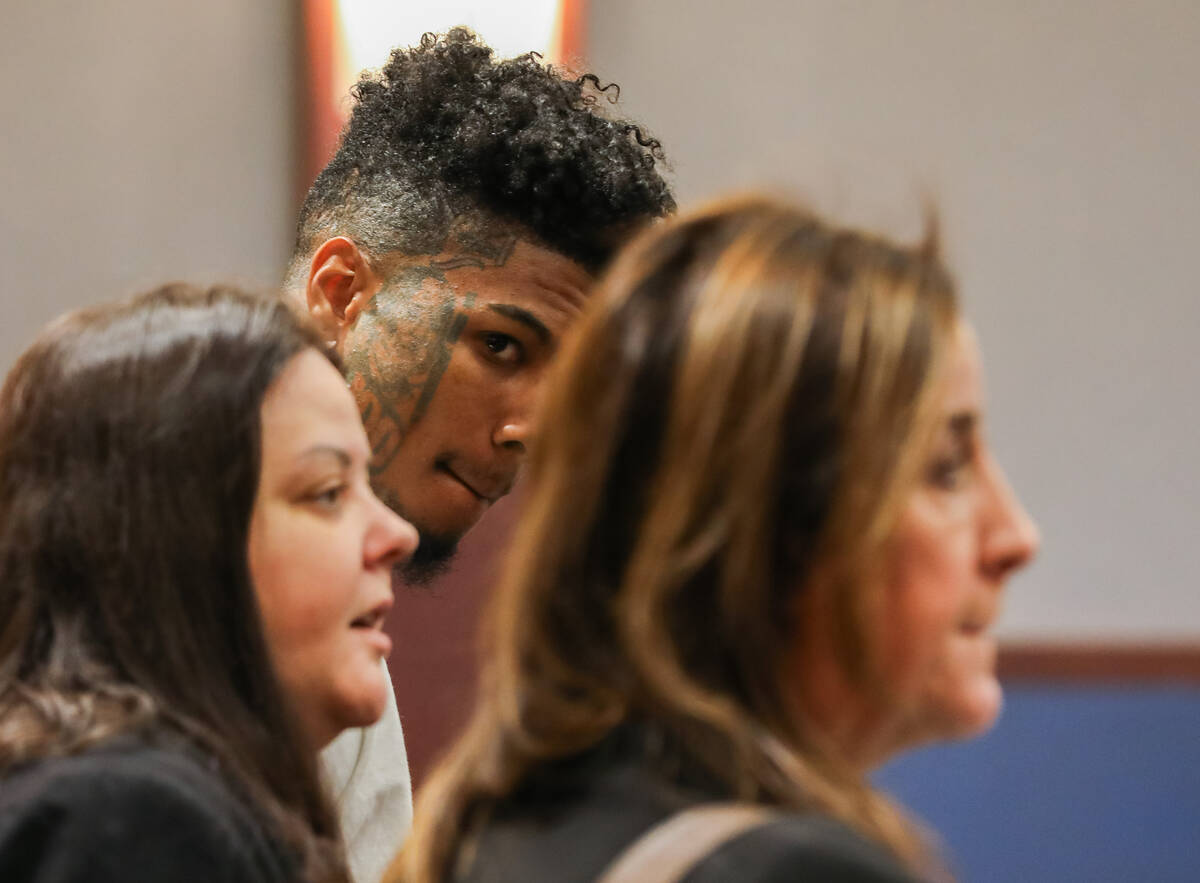 Johnathan Jamall Porter, a rapper known as Blueface, appears in court alongside his attorneys, ...
