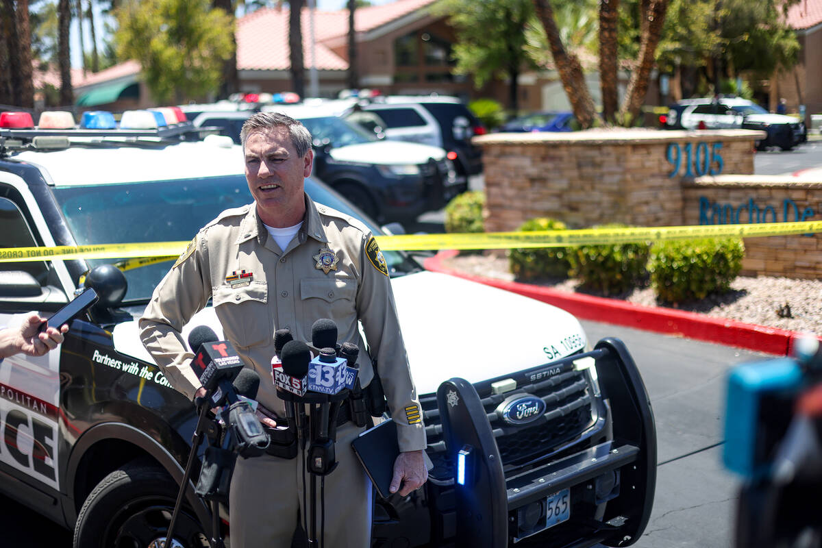 Metro homicide Lt. Jason Johansson addresses the media at the scene of a homicide at an apartme ...
