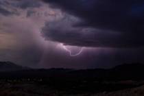 Lightning erupts as a monsoon storm moves across the valley on Thursday, Aug. 11, 2022, in Las ...