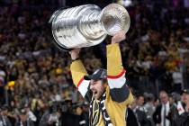 Golden Knights defenseman Brayden Pachal (94) celebrates with the Stanley Cup after winning the ...