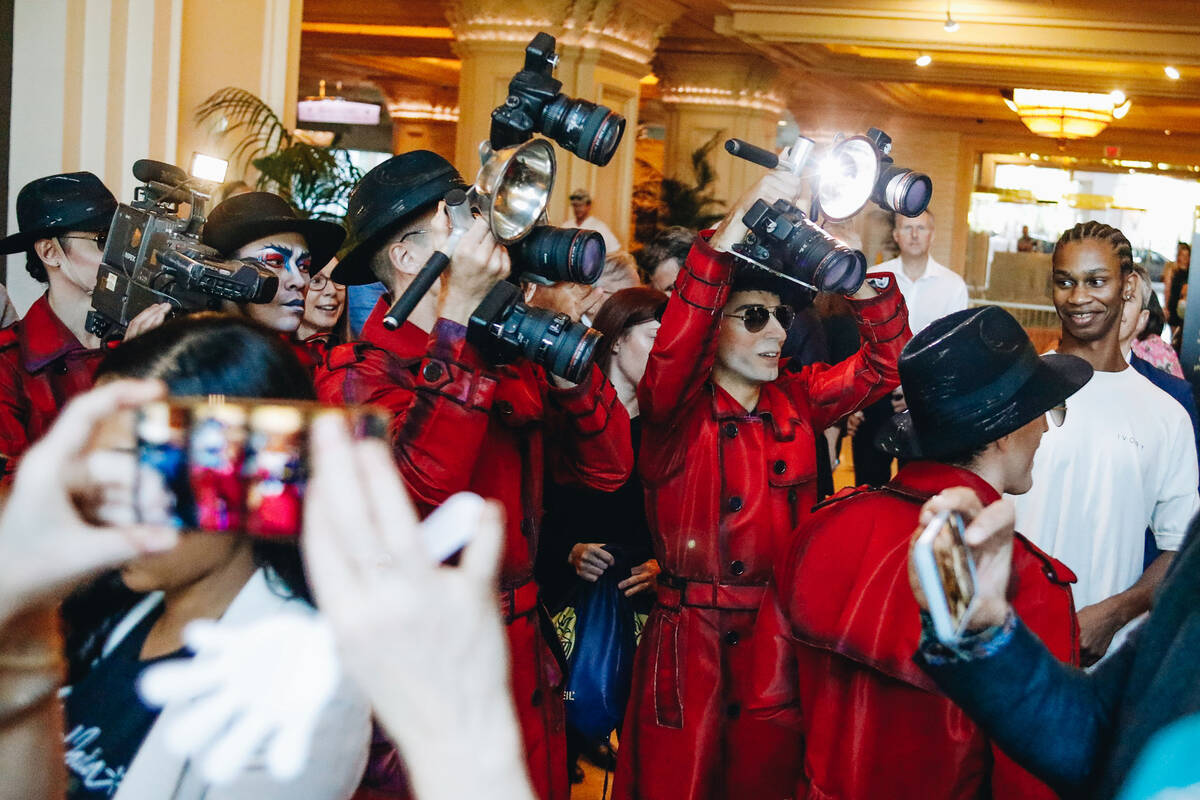 Cast members from “Michael Jackson ONE” pretend to swarm Mandalay Bay guests and ...