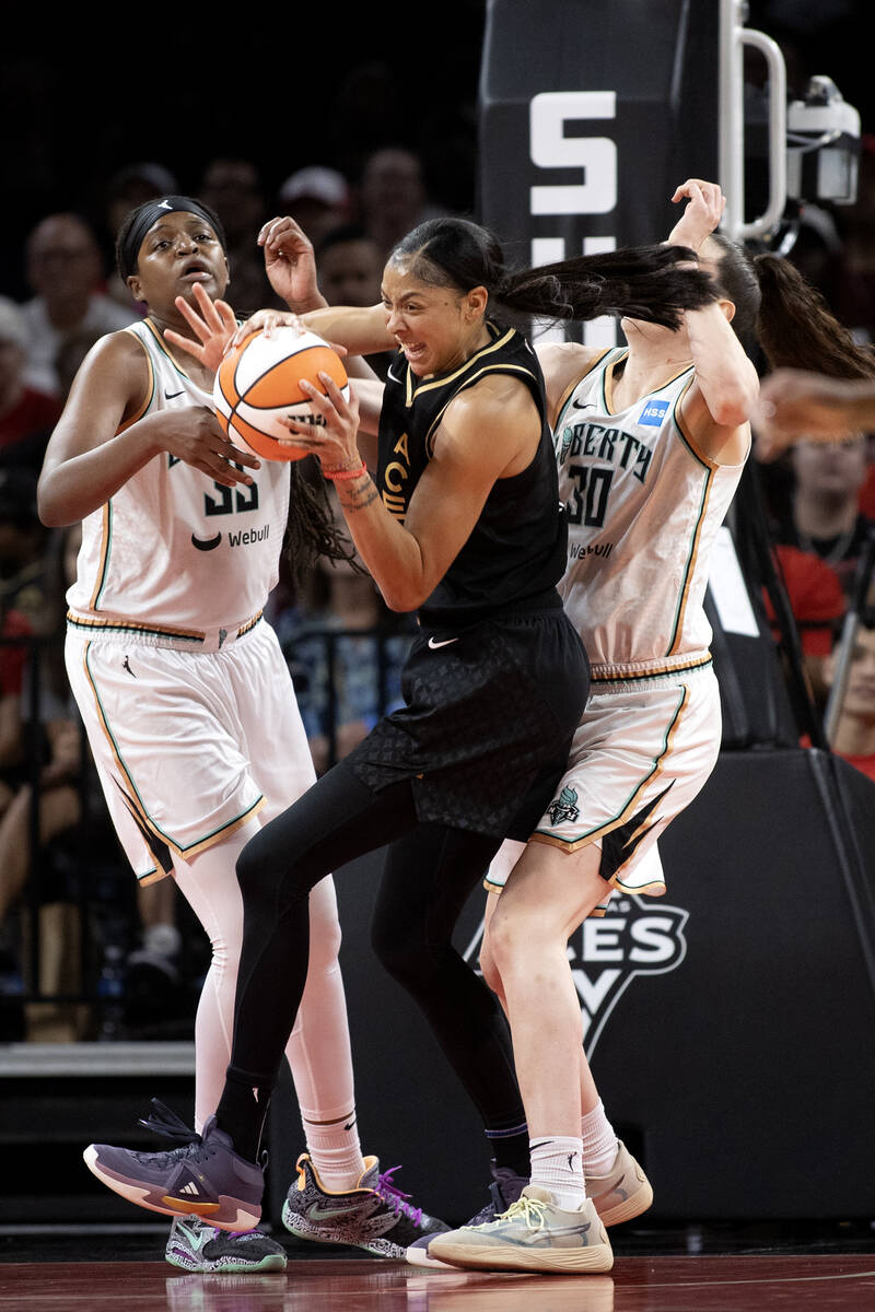 Las Vegas Aces forward Candace Parker (3) steals possession from New York Liberty forward Jonqu ...