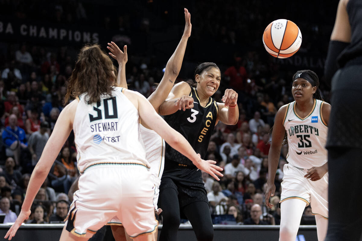 Las Vegas Aces forward Candace Parker (3) passes around New York Liberty players including forw ...