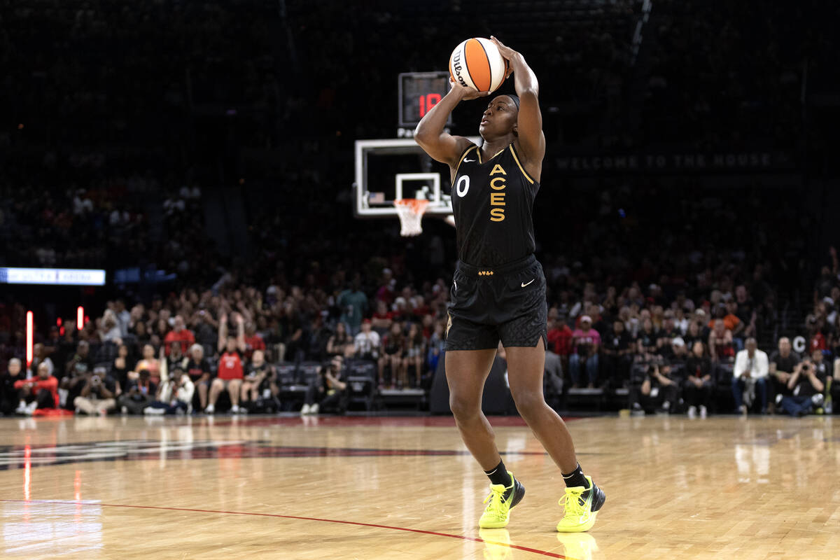 Las Vegas Aces guard Jackie Young (0) shoots a three-pointer during the second half of a WNBA b ...