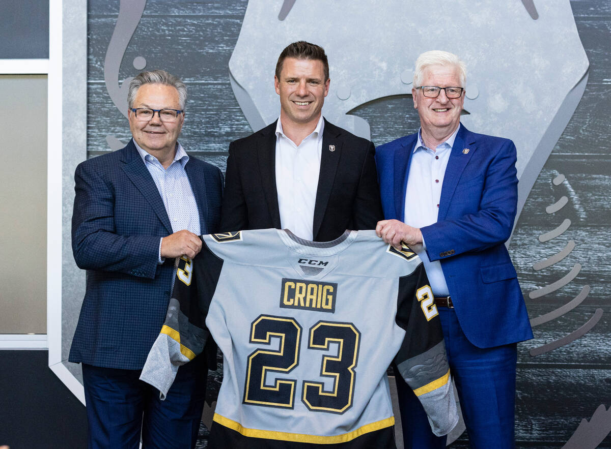 Golden Knights General Manager Kelly McCrimmon, left, and Tim Speltz, right, Silver Knights gen ...