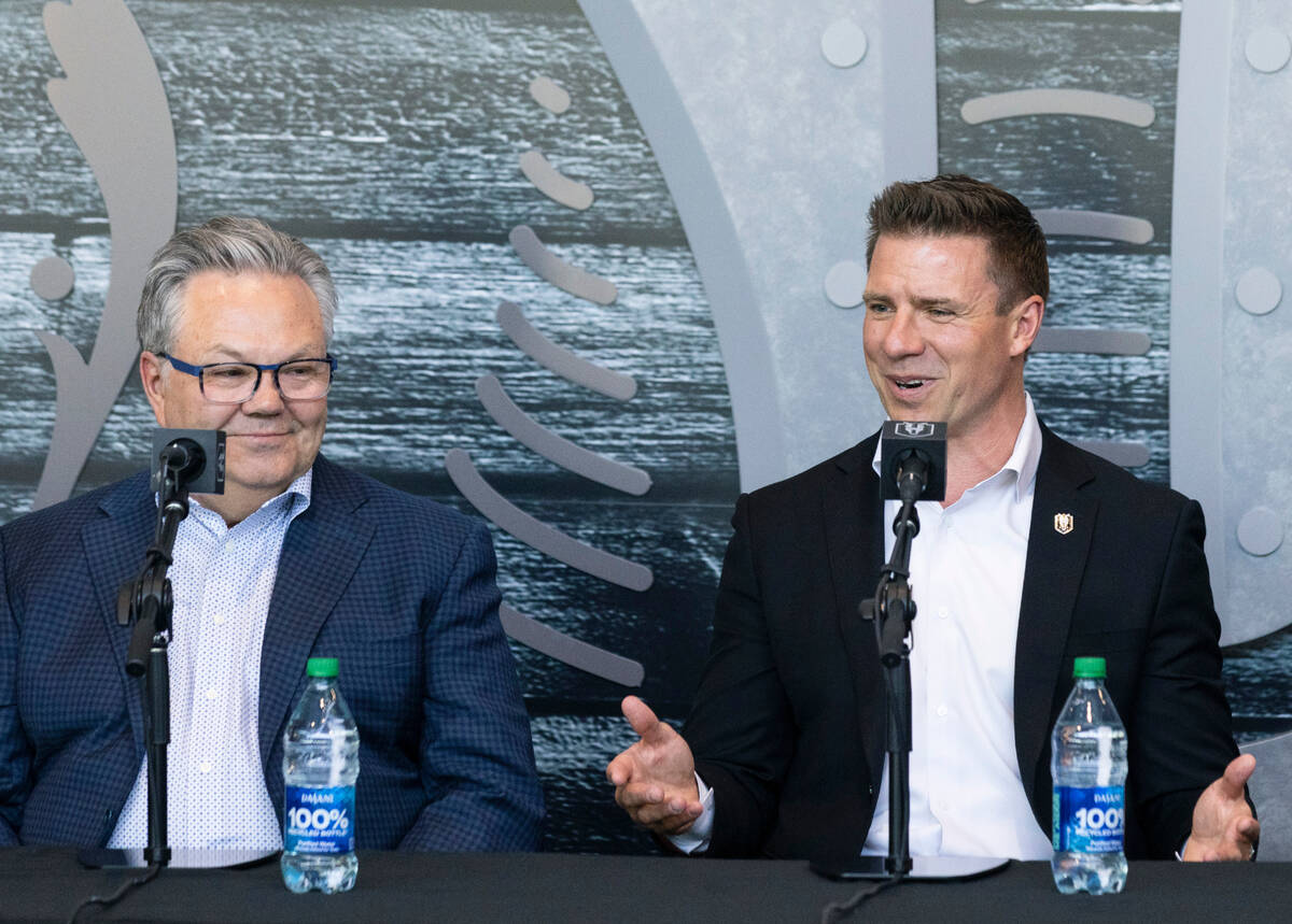 Ryan Craig, smiles as he speaks as Golden Knights General Manager Kelly McCrimmon, left, looks ...