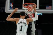 San Antonio Spurs' Victor Wembanyama, the No. 1 draft pick, dunks during an NBA basketball pres ...