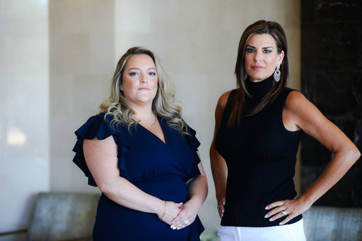 Ashley Dickerson, branch manager and senior escrow officer for WFG National Title, left, and Ja ...