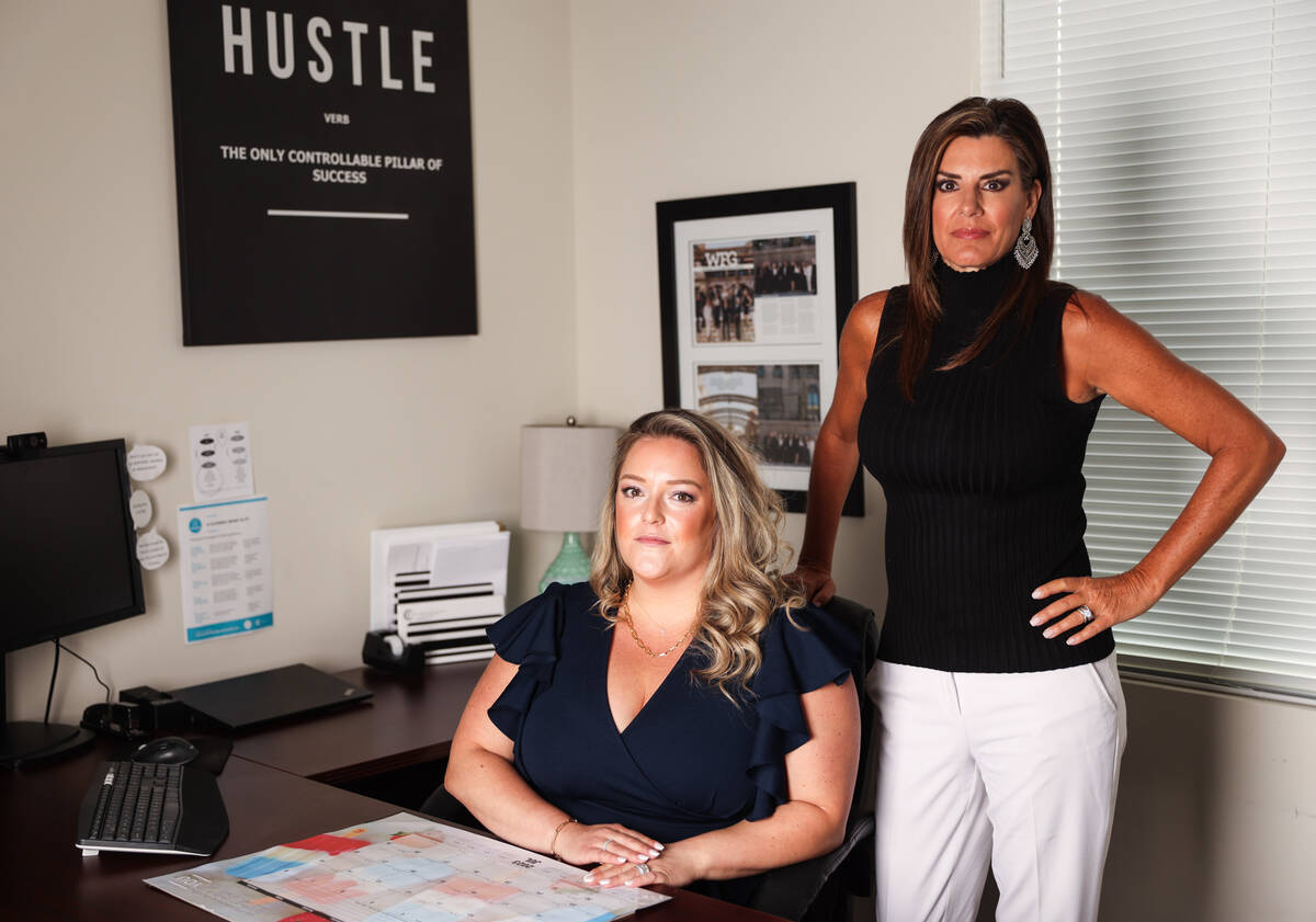 Ashley Dickerson, branch manager and senior escrow officer for WFG National Title, left, and Ja ...
