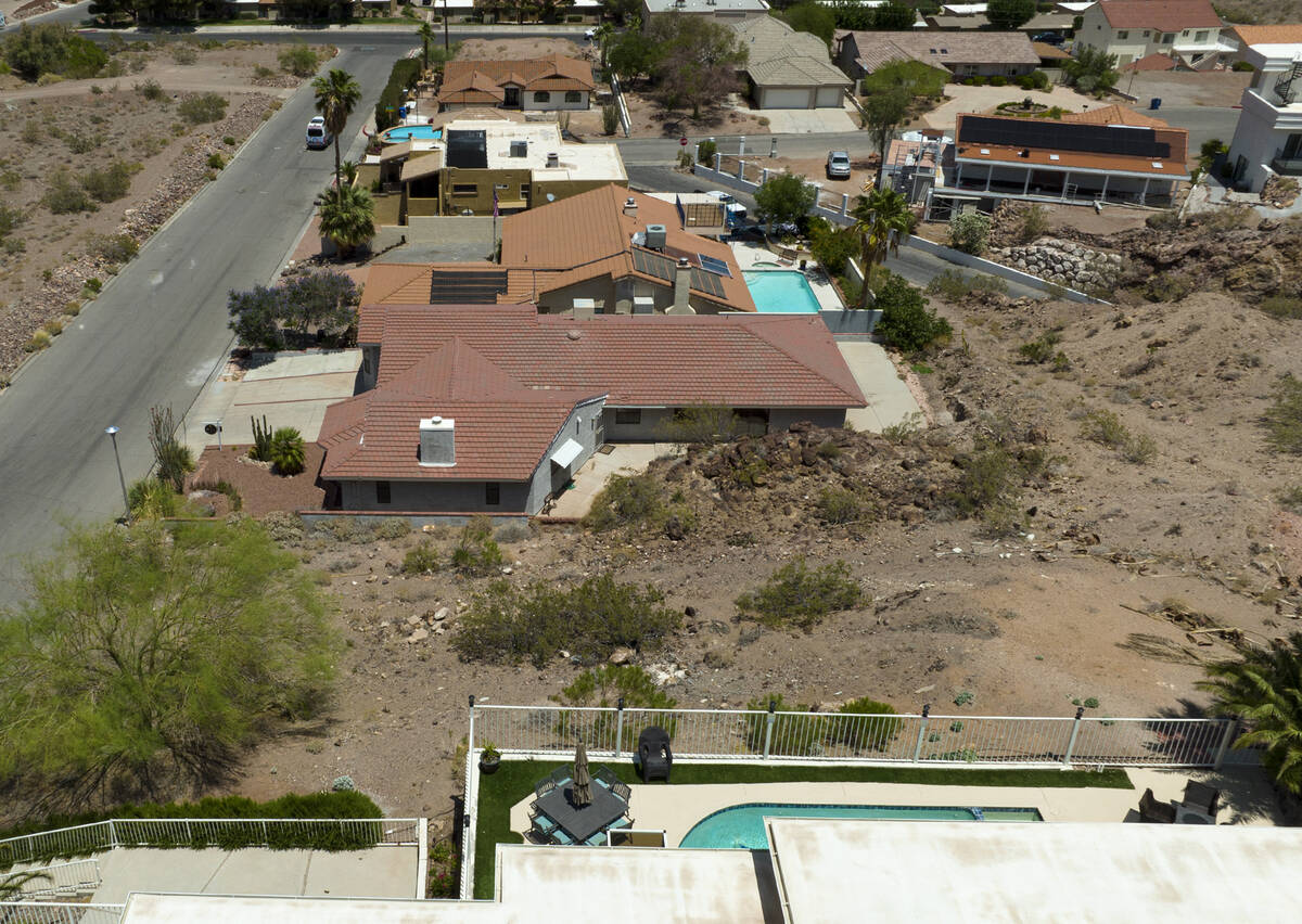 A vacant homesite, center, is seen at the corner of Judi Place and Isabel Drive, on June 2, 202 ...