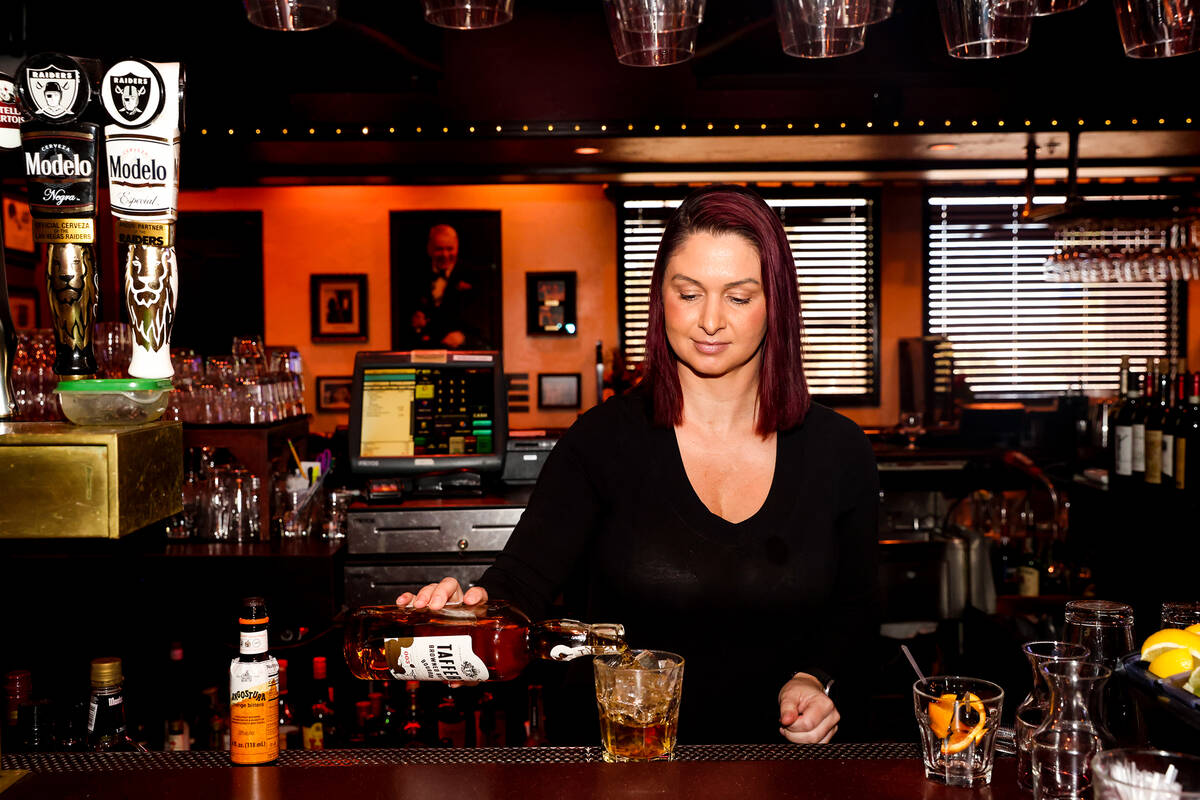 Bartender Ashley Harris creates an old fashioned with Taffer’s Browned Butter Bourbon, a ...