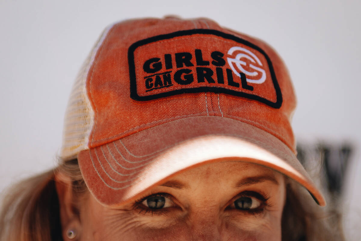Christie Vanover wears one of her Girls Can Grill hats on Friday, June 30, 2023, at her home in ...
