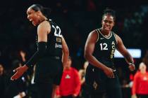 Las Vegas Aces teammates A’ja Wilson (22) and Chelsea Gray (12) celebrate a basket made ...