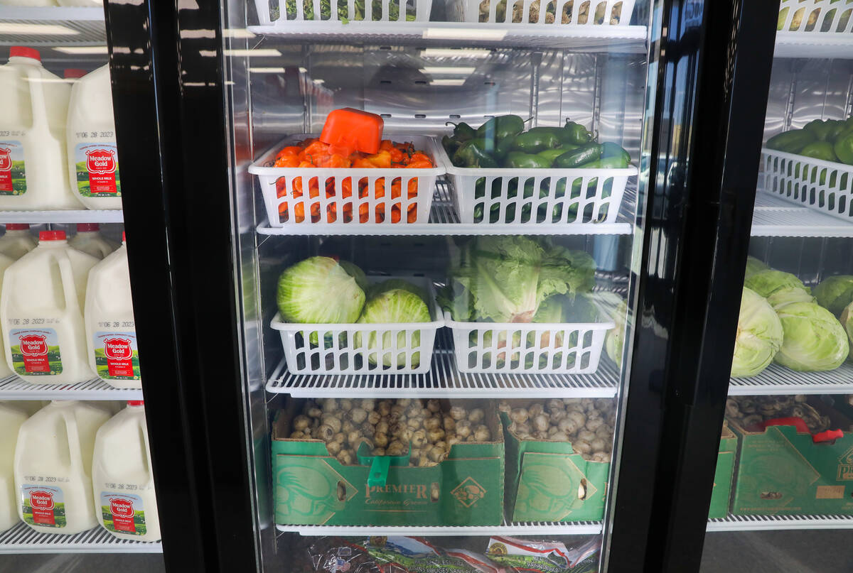 A refrigerator keeping fresh vegetables and dairy items cool at The After Market on Thursday, J ...