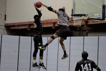 Dionte Byrd of the MOB blocks a shot by Ralph Bellamy of the Buzzsaw during a SlamBall game. (S ...