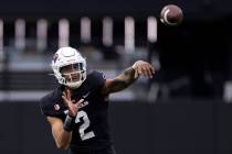 Quarterback Doug Brumfield (2) passes during the UNLV spring showcase game at Allegiant Stadium ...