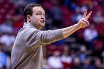 UNLV head coach Kevin Kruger signals his players against Utah State during the second half of t ...