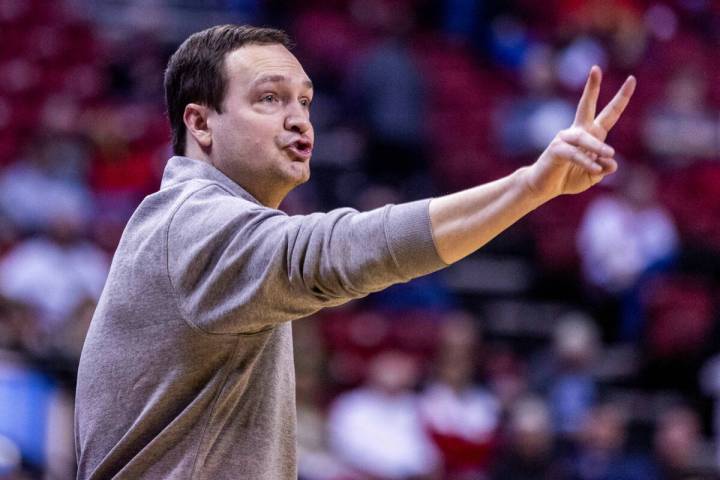 UNLV head coach Kevin Kruger signals his players against Utah State during the second half of t ...