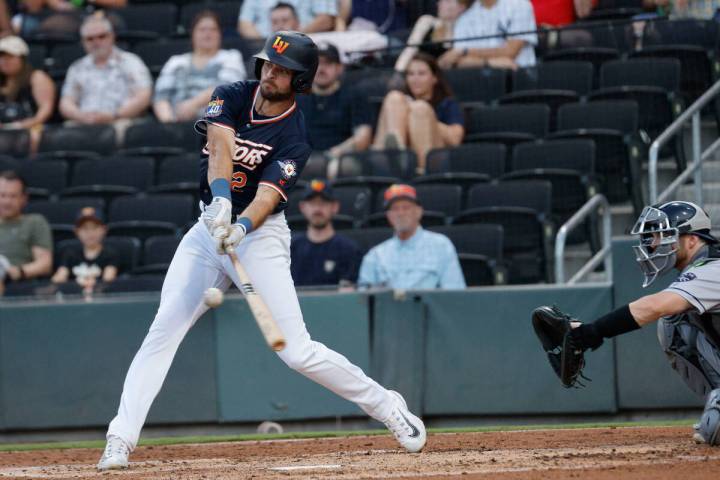 Aviators outfielder Cody Thomas (12) connects with the ball during the second inning of a baseb ...