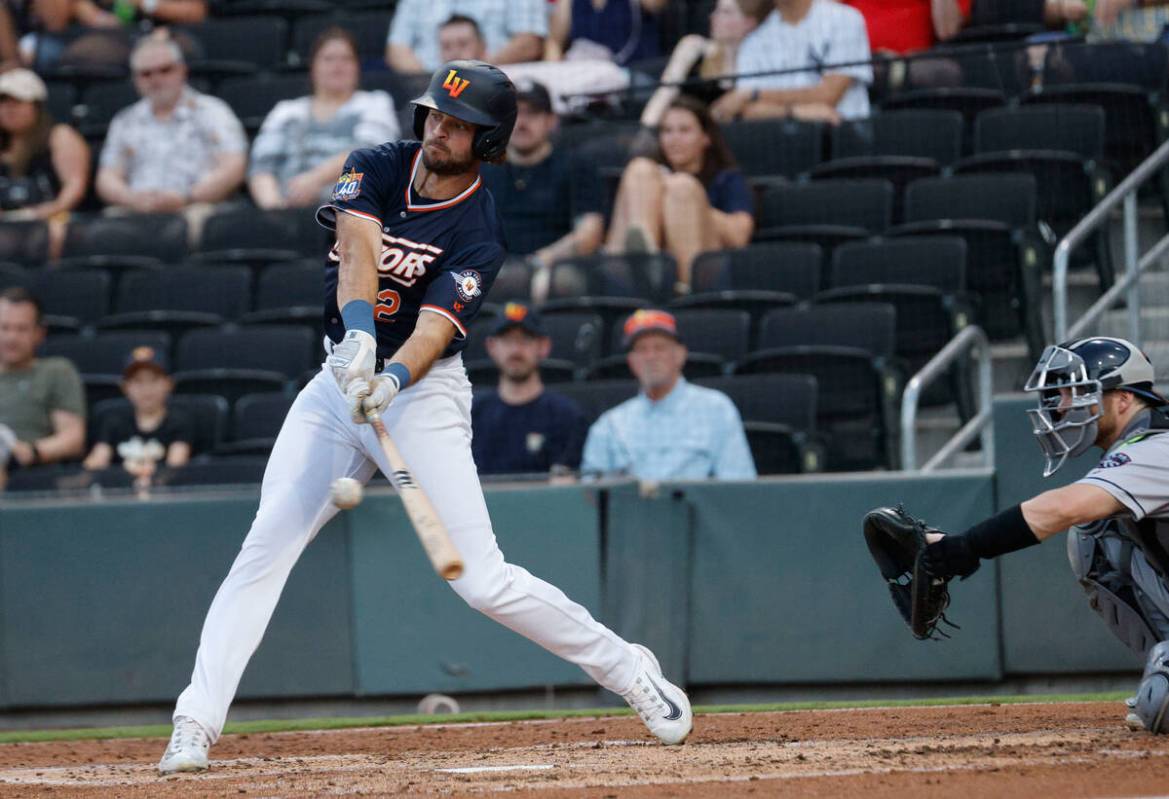 Aviators outfielder Cody Thomas (12) connects with the ball during the second inning of a baseb ...