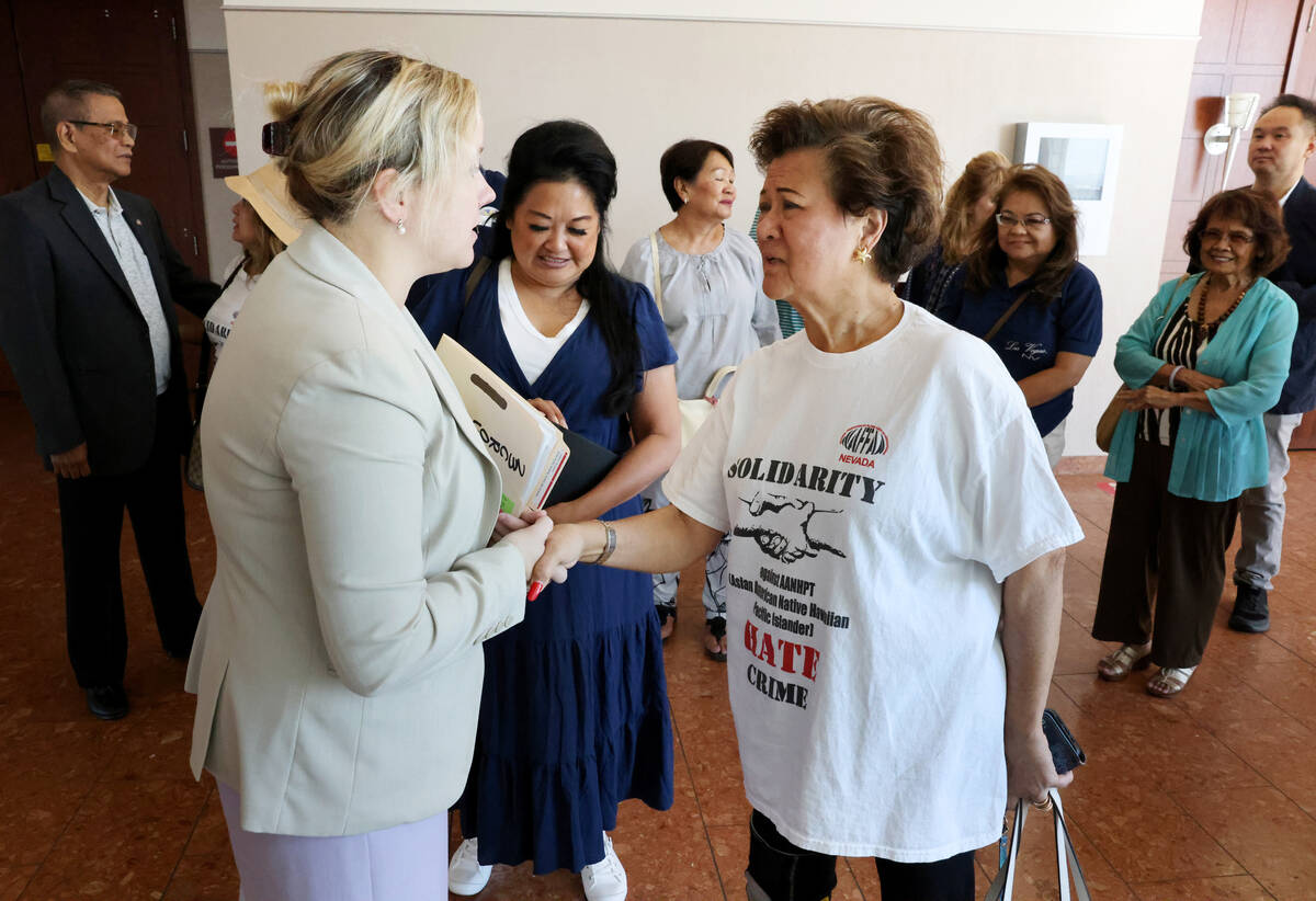 Gloria Caoile, right, thanks Clark County Chief Deputy District Attorney Colleen Baharav, outsi ...