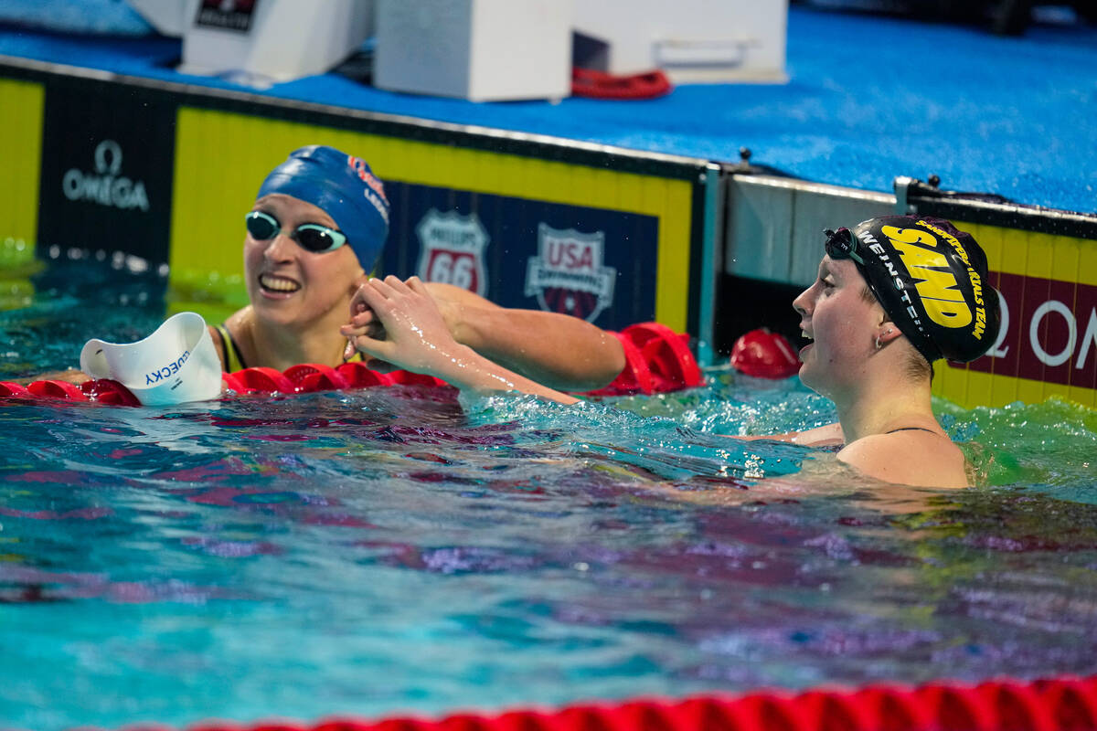 Claire Weinstein, right, celebrates with Katie Ledecky after winning the women's 200-meter free ...