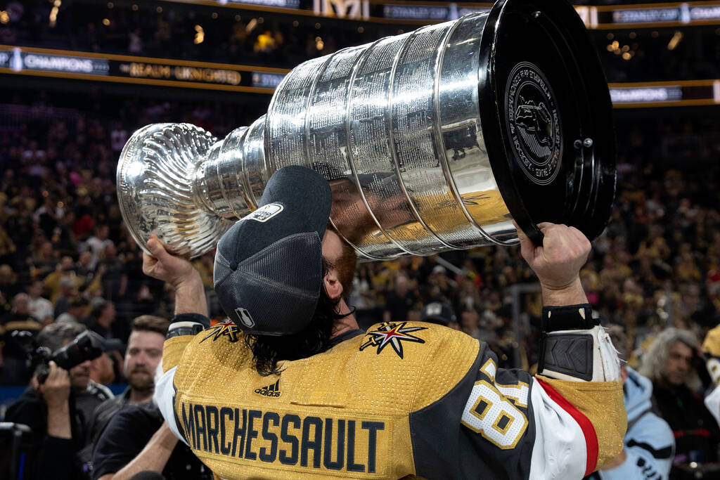 Golden Knights right wing Jonathan Marchessault (81) kisses with the Stanley Cup after winning ...