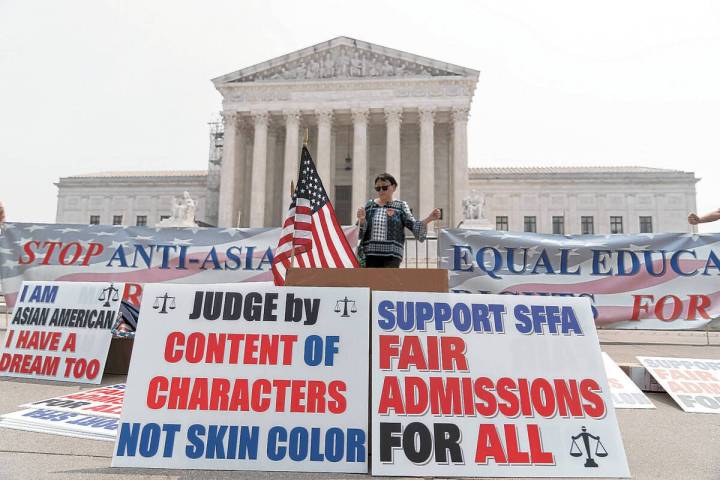 A person protests outside of the Supreme Court in Washington, Thursday, June 29, 2023. (AP Phot ...
