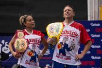 This year's woman's champion Miki Sudo, left, and man's champion Joey Chestnut, right, stand to ...
