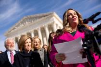 Lorie Smith, a Christian graphic artist and website designer in Colorado, right, accompanied by ...
