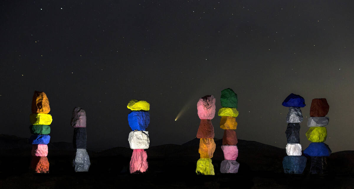 Comet NEOWISE streaks across the sky above the Seven Magic Mountains art installation on July 1 ...