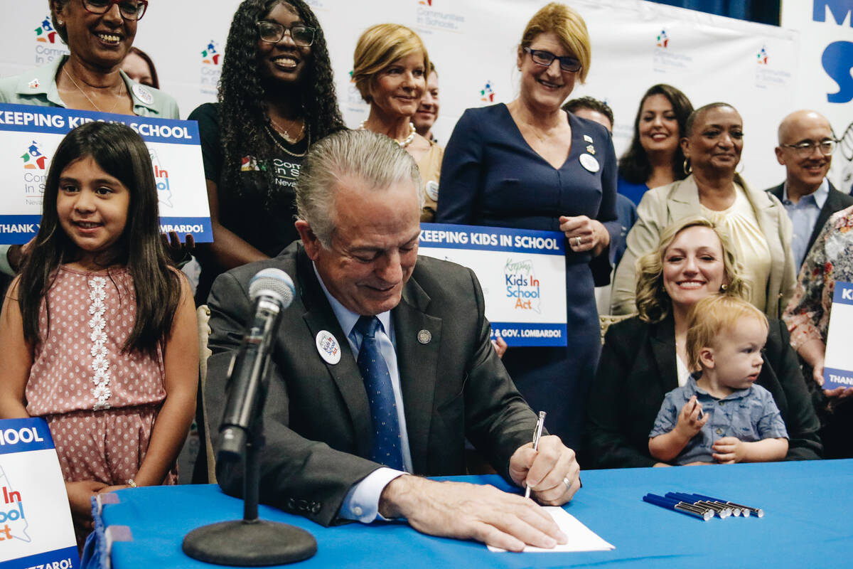 Nevada Gov. Joe Lombardo signs a bill for the Keeping Kids in School Act during a ceremonial si ...