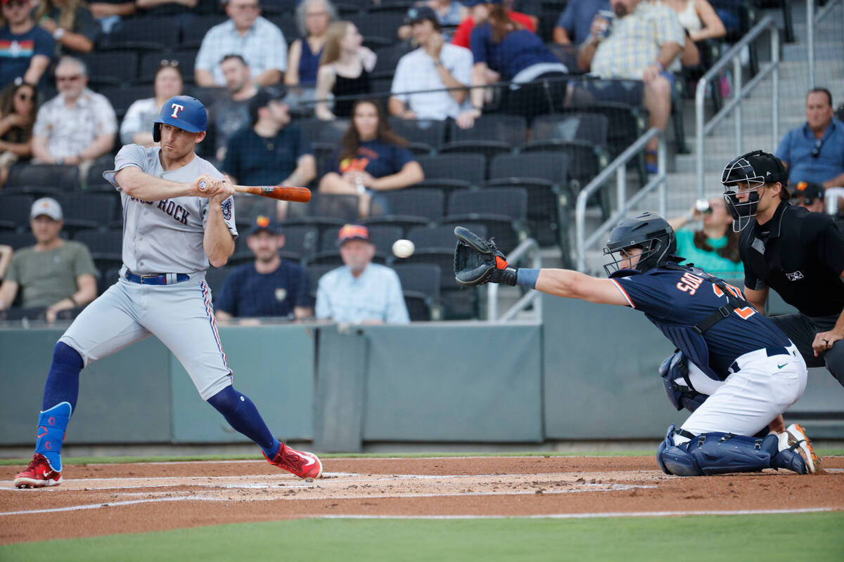 Aviators catcher Tyler Soderstrom (21) receives a ball as Round Rock Express outfielder Brad Mi ...