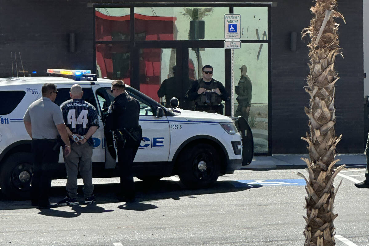 Zachary Stern, 39, is taken into custody near the scene where a 6-year-old girl and man in his ...