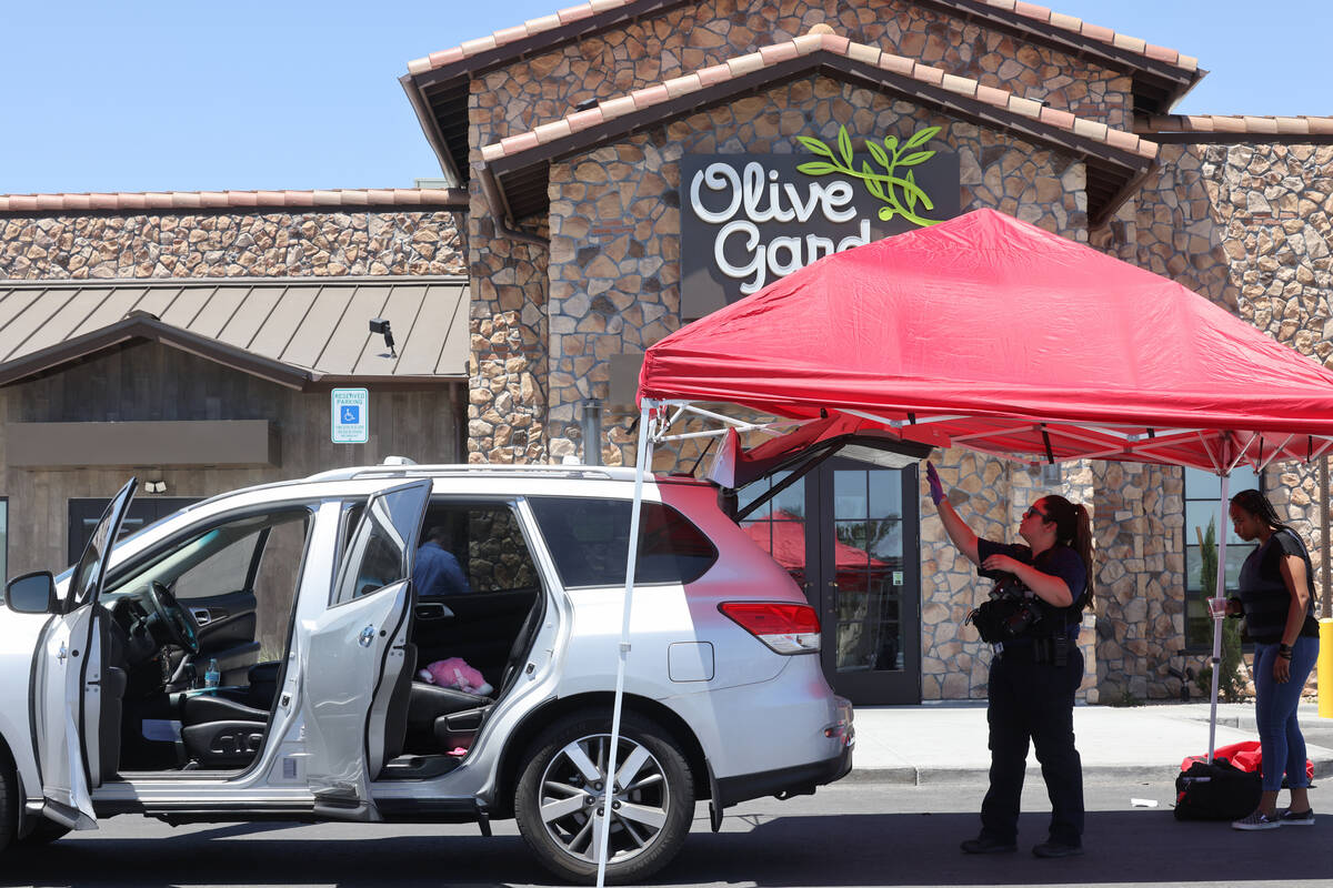 A stuffed animal is seen on the back seat of a car as North Las Vegas Police investigate where ...