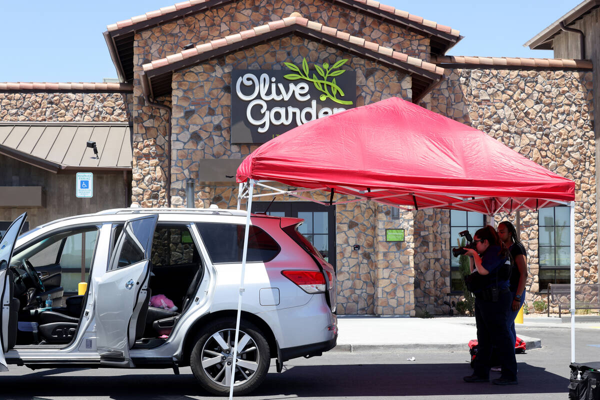 A stuffed animal is seen on the back seat of a car as North Las Vegas Police investigate where ...