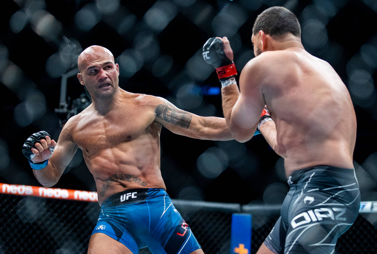Robbie Lawler, left, steps back from Nick Diaz in the first round during their welterweight fig ...