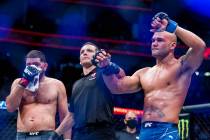 Robbie Lawler, right, and Nick Diaz after Lawler wins their welterweight fight in UFC 266 at T- ...