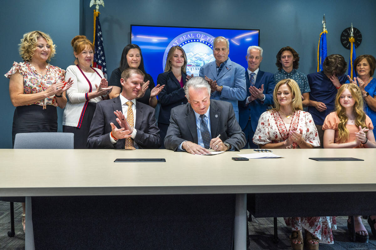 Nevada Gov. Joe Lombardo conducts a ceremonial signing of SB 322 aka Rex's Law about members of ...