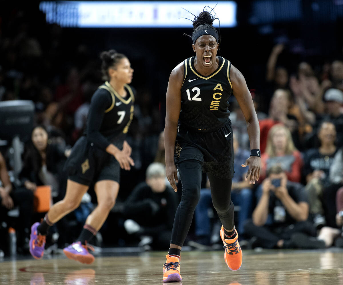 Las Vegas Aces guard Chelsea Gray (12) celebrates after scoring during the first half of a WNBA ...