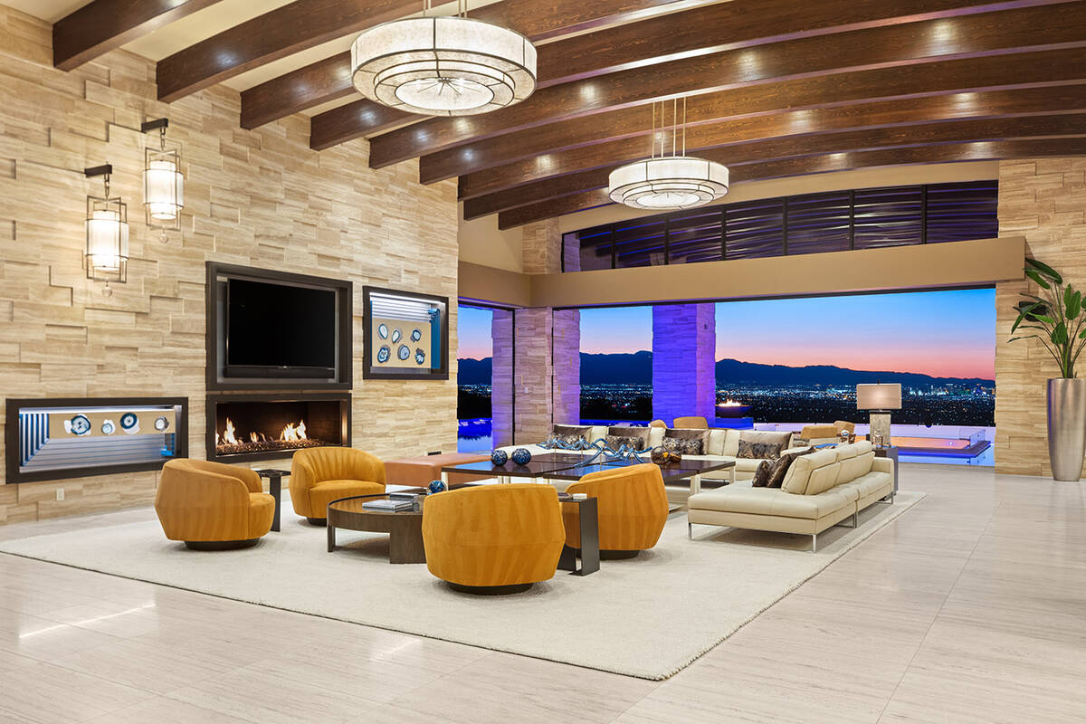 Designed and built by Sun West Custom Homes, the one-story home measures 12,101 square feet and ...