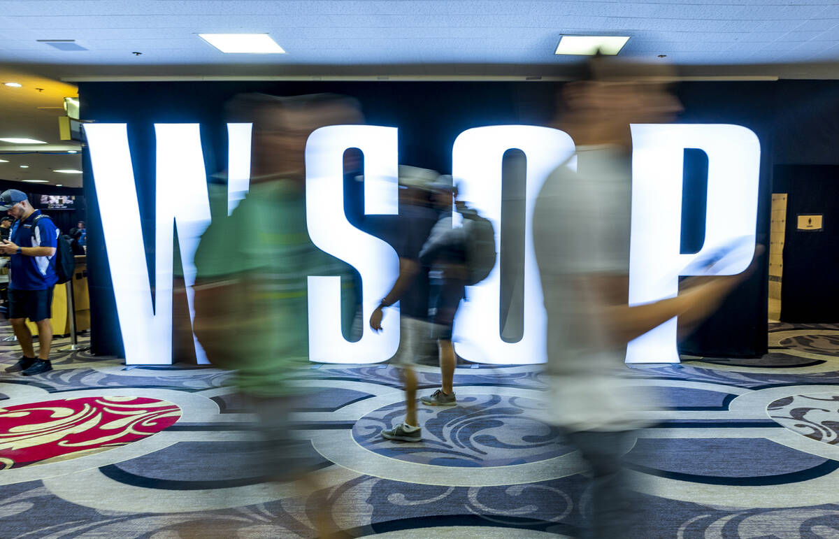 Attendees stream about during the final starting flight of World Series of Poker $10,000 buy-in ...