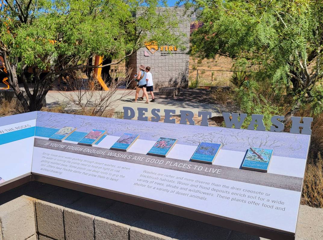 Visitors exploring the impressive and informative outdoor exhibits behind Red Rock’s vis ...