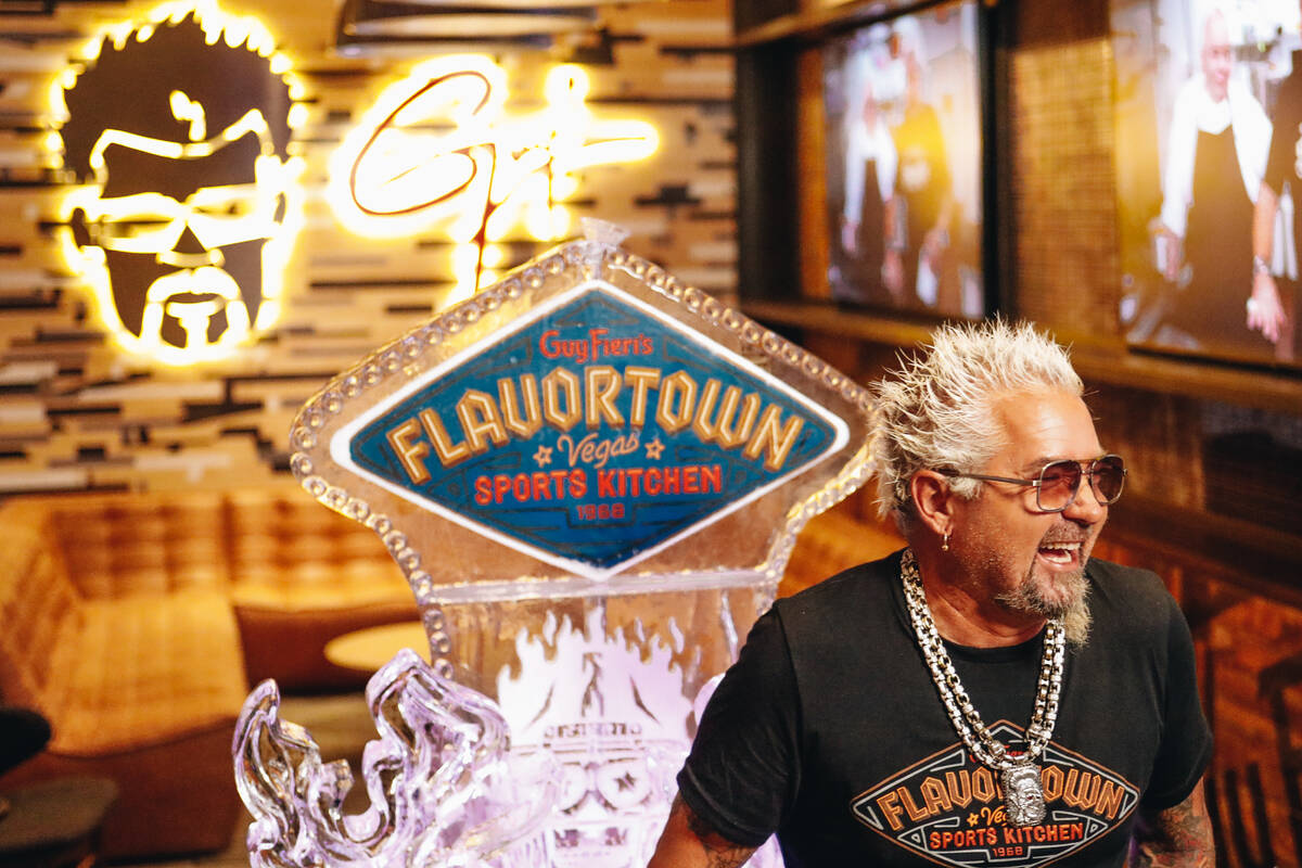 Guy Fieri laughs as he answers questions about his new restaurant on Friday, July 7, 2023, at G ...