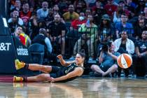 Las Vegas Aces guard Kelsey Plum (10) lands on the court after a hard foul under the basket fro ...
