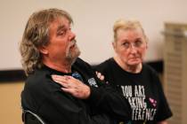 Scott Bunn, left, is comforted by his wife Debra as he discusses medical conditions he attribut ...
