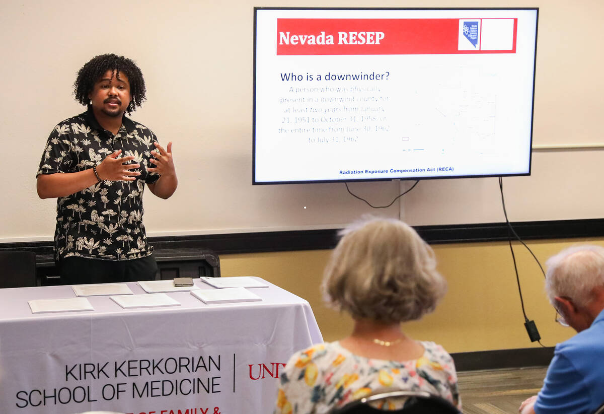 Drewmel Darby, eligibility coordinator for Nevada RESEP, addresses a crowd of people at a downw ...